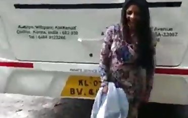 Despondent Pakistani girl change dress on road